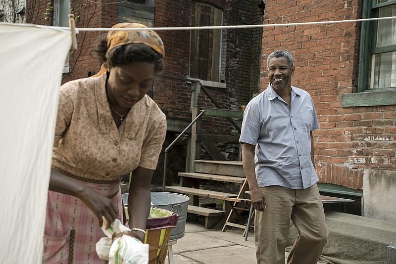 This image released by Paramount Pictures shows Denzel Washington, right, and Viola Davis in a scene from "Fences," directed by Washington. (David Lee/Paramount Pictures via AP)
            