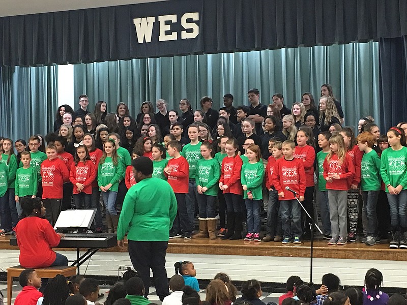 The choirs from Ooltewah Middle and Soddy Elementary schools perform at a holiday concert at Woodmore Elementary School.