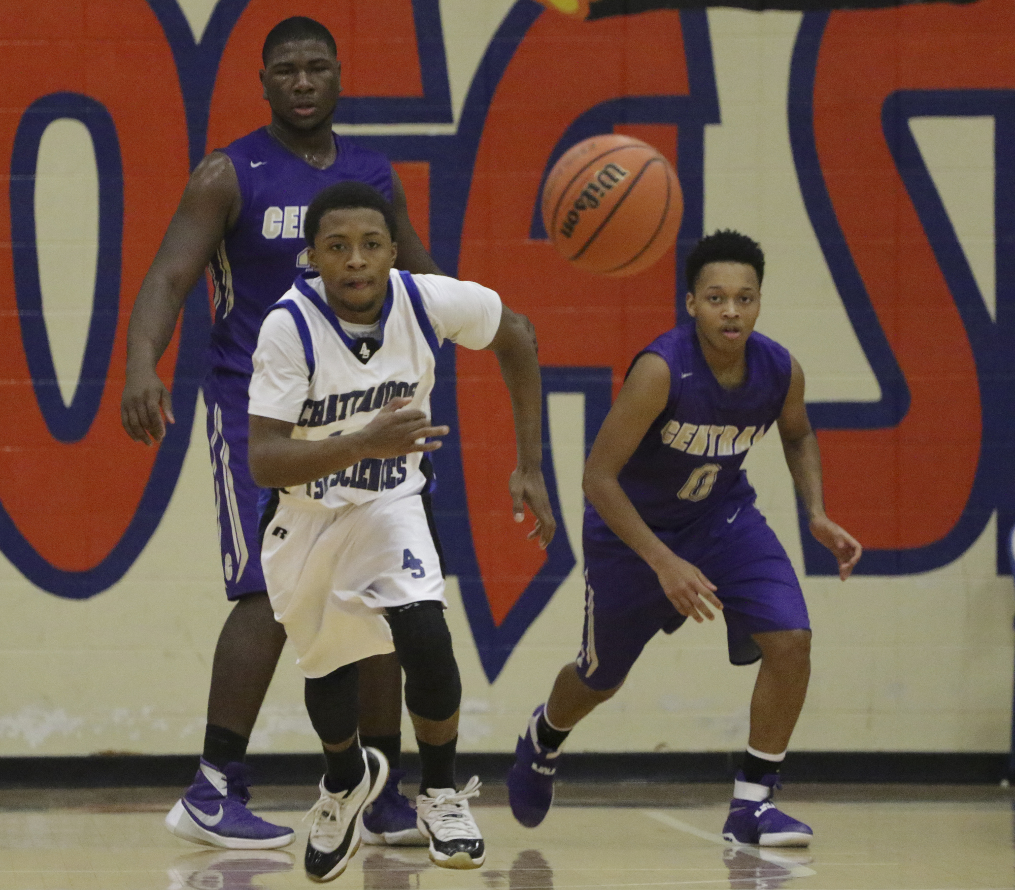 Staff Photo by Dan Henry / The Chattanooga Times Free Press- 12/22/16. CSAS's Darius Graves (14) and Central's Cavonte McKibbens (0) chase a loose ball during the Best of Preps tournament on December 22, 2016 being held at Chattanooga State. CSAS won over Central with a final score of 53-50.
