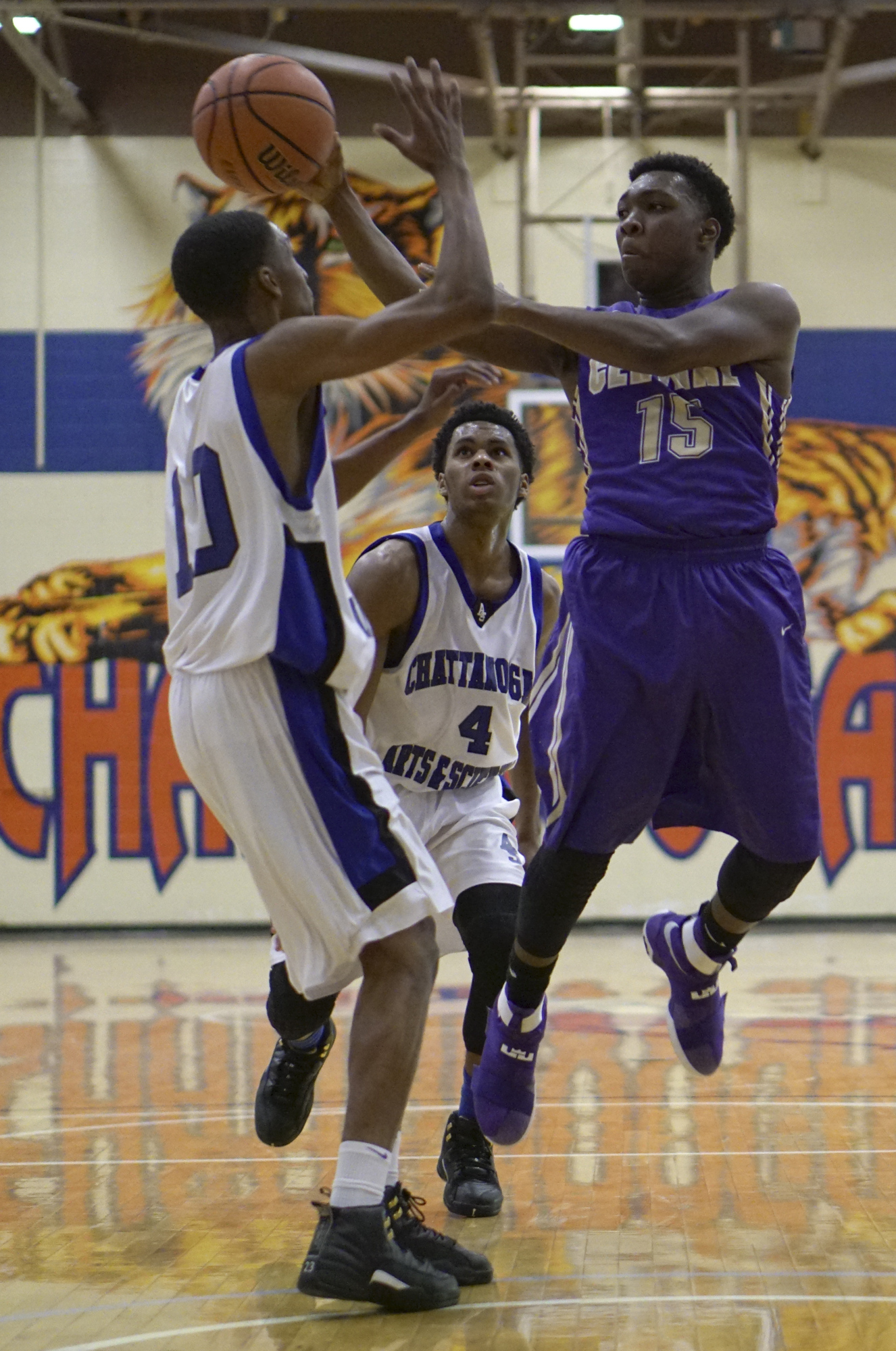 Staff Photo by Dan Henry / The Chattanooga Times Free Press- 12/22/16. CSAS's Jameel Dodds (10) and Miguel Hamilton (4) defend as Central's Julius Jackson (15) passes to a teammate during the Best of Preps tournament on December 22, 2016 being held at Chattanooga State. CSAS won over Central with a final score of 53-50.