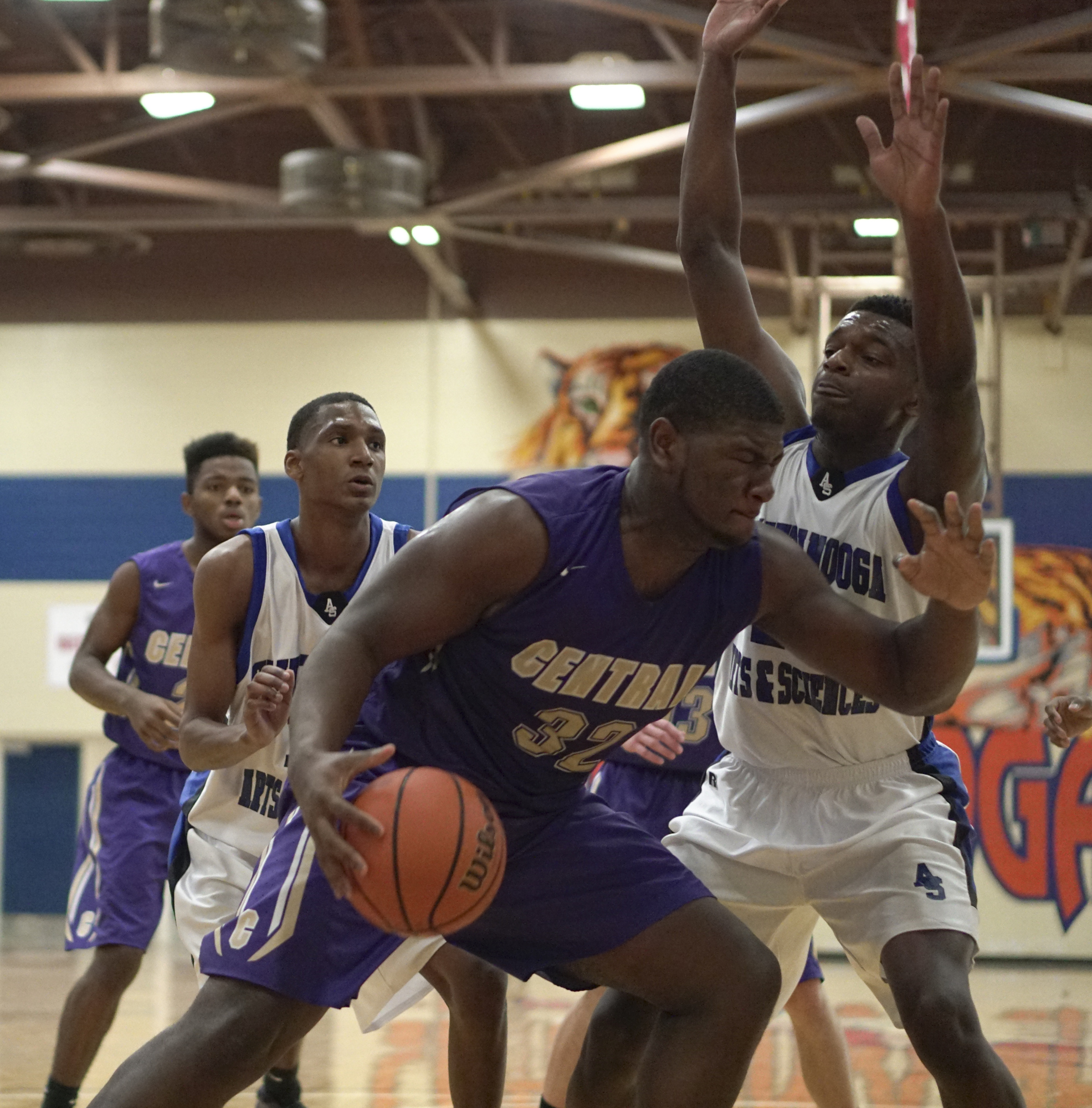 Staff Photo by Dan Henry / The Chattanooga Times Free Press- 12/22/16. CSAS's Jordan House (24) defends as Central's McClendon Curtis (32) looks for a shot during the Best of Preps tournament on December 22, 2016 being held at Chattanooga State. CSAS won over Central with a final score of 53-50.