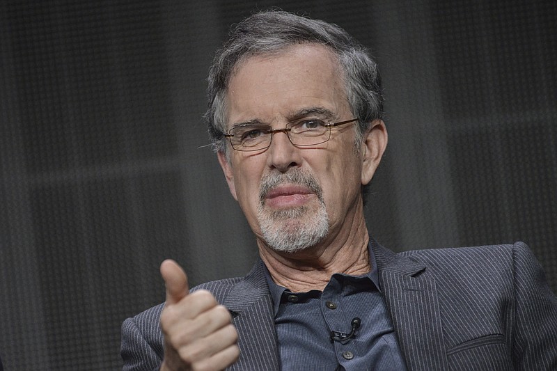 
              FILE - In this July 12, 2014 file photo, Garry Trudeau speaks onstage during the "Alpha House" panel at the Amazon 2014 Summer TCA, in Beverly Hills, Calif. "Doonesbury" cartoonist Trudeau has once again designed the poster for the annual winter carnival in his childhood hometown in New York. The Pulitzer Prize-winning creator of such characters as Mike Doonesbury, Zonker and Uncle Duke has designed the poster for the 2017 Saranac Lake Winter Carnival, which runs from Feb. 3 through Feb. 12. (Photo by Richard Shotwell/Invision/AP, File)
            