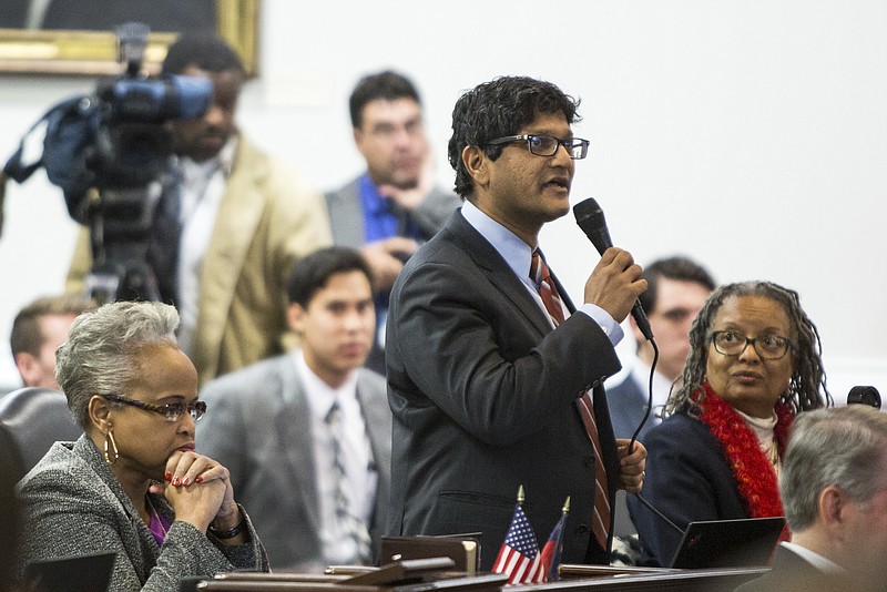 
              State Sen. Jay Chaudhuri, D-Wake, speaks on the senate floor during a special session of the North Carolina General Assembly called to consider repeal of NC HB2 in Raleigh, N.C., Wednesday, Dec. 21, 2016. North Carolina's legislature reconvened to see if enough lawmakers are willing to repeal a 9-month-old law that limited LGBT rights, including which bathrooms transgender people can use in public schools and government buildings.  (AP Photo/Ben McKeown)
            