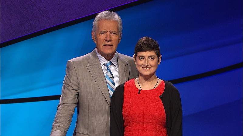In this Aug. 31, 2016, photo provided by Jeopardy Productions, Inc., Cindy Stowell, right, appears on the "Jeopardy!" set with Alex Trebek in Culver City, Calif. Stowell, who died of cancer just days before her appearance on "Jeopardy!" aired won six contests in a row and more than $103,000, some of which has been donated toward cancer research. Stowell's run ended when she finished second in her seventh appearance that aired on Wednesday, Dec. 21. (Courtesy of Jeopardy Productions, Inc. via AP)