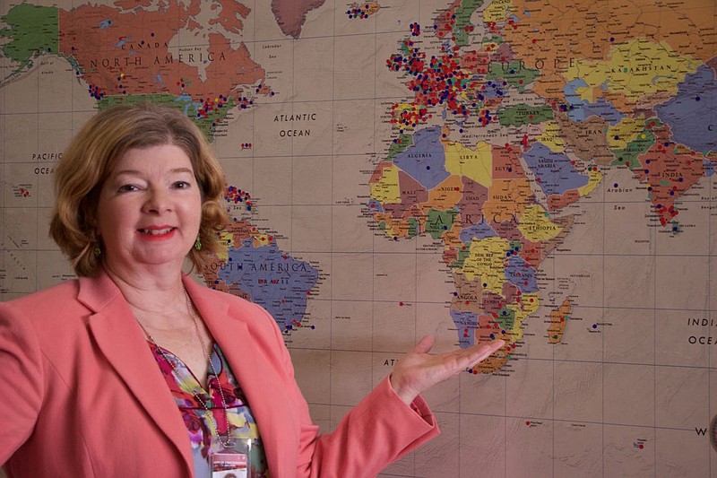 The Chattanooga Public Library's Passport Acceptance Program Manager, Diane Moore, has been chosen by the U.S. Department of State as the 2016 Passport Acceptance Agent of the Year.  Moore, a library employee for 21 year, stands in front of the library's Passport Destination Map she created, where passport customers are invited to pin their destination.