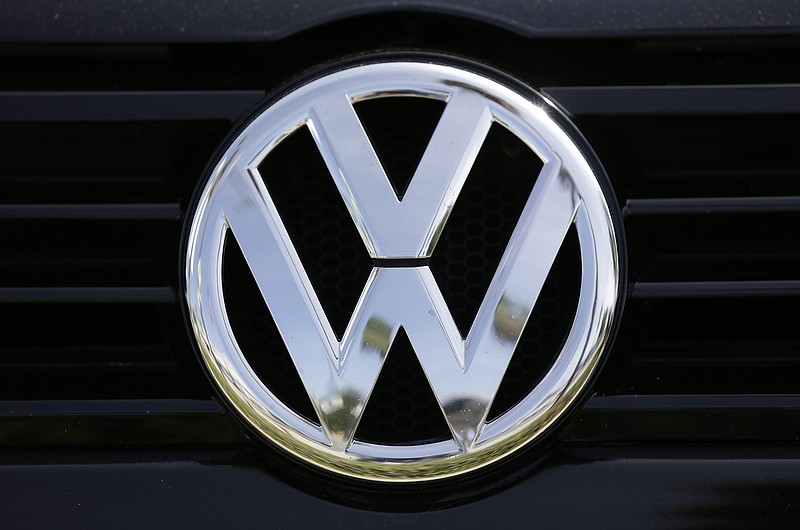 
              FILE - In this Sept. 21, 2015, file photo, a Volkswagen logo is seen on car offered for sale at New Century Volkswagen dealership in Glendale, Calif. Volkswagen is facing a deadline of Monday, Dec. 19, 2016, to tell a federal judge in San Francisco whether it has reached a deal with U.S. regulators and attorneys for car owners on the remaining 80,000 diesel vehicles that cheated on emissions tests. (AP Photo/Damian Dovarganes, File)
            