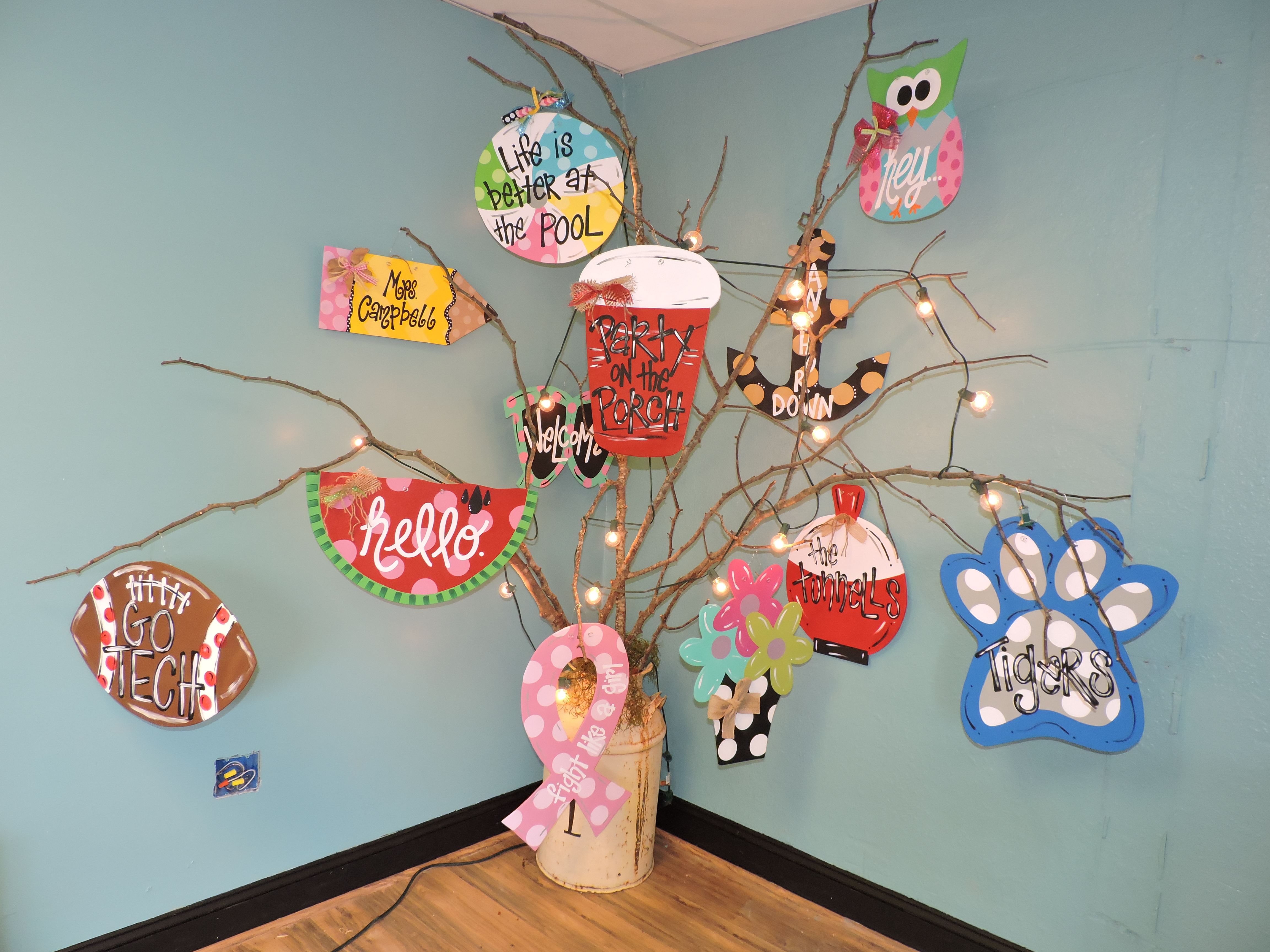 Alydots hosts paint parties during which owners and clients create an assortment of door hangers such as these for guests to take home.