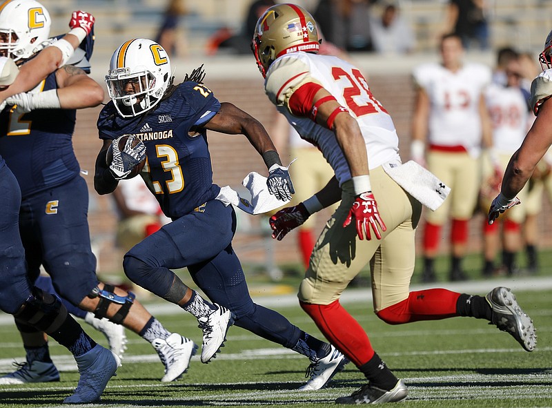 UTC running back Richardre Bagley breaks around VMI defensive back Matthew Nicholson during the Mocs' home football game against the VMI Keydets at Finely Stadium on Saturday, Oct. 22, 2016, in Chattanooga, Tenn.