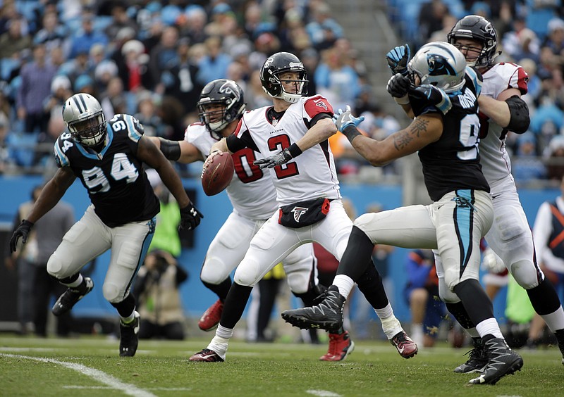 Atlanta Falcons' Matt Ryan (2) looks to pass against the Carolina Panthers in the second half of an NFL football game in Charlotte, N.C., Saturday, Dec. 24, 2016. (AP Photo/Bob Leverone)