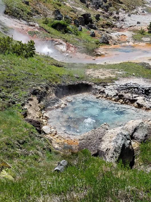 The Artists Paintpots trail on the west side of the park is away from the crowds and is a great place to explore a hydrothermal basin. (Photo by Jamie Smith)