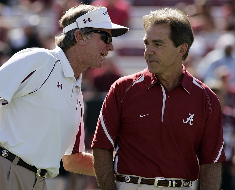 Alabama coach Nick Saban, right, chats with South Carolina coach Steve Spurrier before the start of an NCAA college football game Saturday, Oct. 9, 2010, at Williams Brice Stadium in Columbia, S.C. (AP Photo/Mary Ann Chastain)