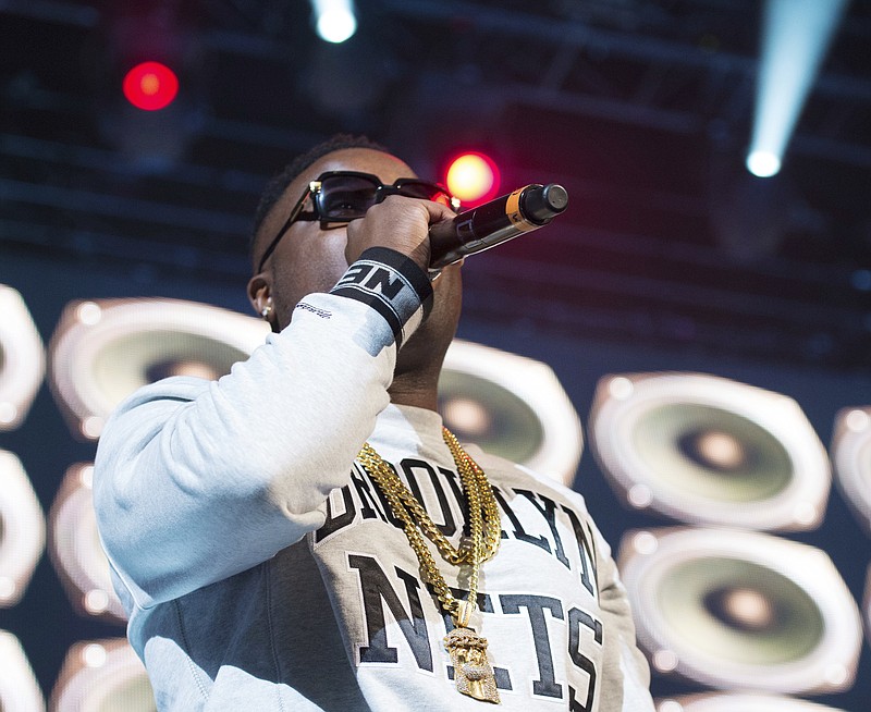 
              FILE - In this Dec. 19, 2014, file photo, Troy Ave performs at "Christmas in Brooklyn" at the Barclays Center in New York's Brooklyn borough. Authorities said Sunday, Dec. 25, 2016, that rapper Troy Ave has been shot while sitting in his car at a Brooklyn intersection. (Photo by Scott Roth/Invision/AP, File)
            