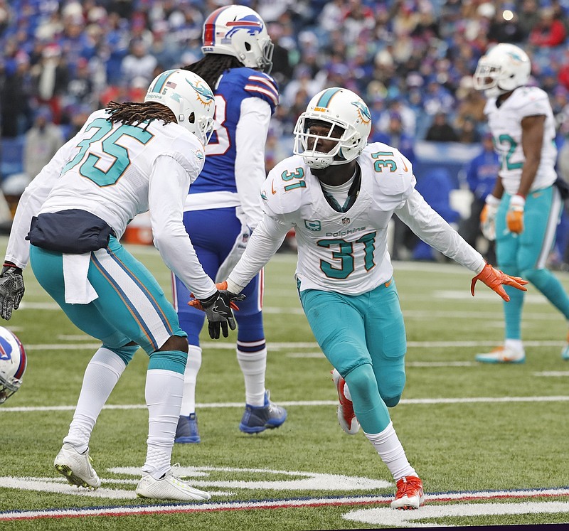 Dolphins earn 1st playoff berth since 2008 with Denver loss