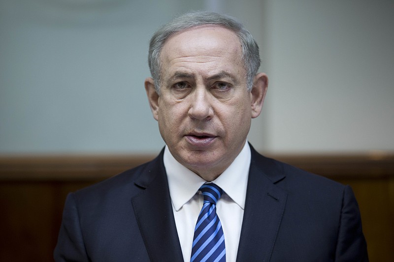 In this Dec. 11, 2016, file photo, Israeli Prime Minister Benjamin Netanyahu attends the weekly cabinet meeting at his office in Jerusalem. Netanyahu lashed out at President Barack Obama on Saturday, Dec. 24, accusing him of a "shameful ambush" at the United Nations over West Bank settlements and saying he is looking forward to working with his "friend" President-elect Donald Trump. Netanyahu's comments came a day after the United States broke with past practice and allowed the U.N. Security Council to condemn Israeli settlements in the West Bank and east Jerusalem as a "flagrant violation" of international law. (Abir Sultan, Pool via AP)