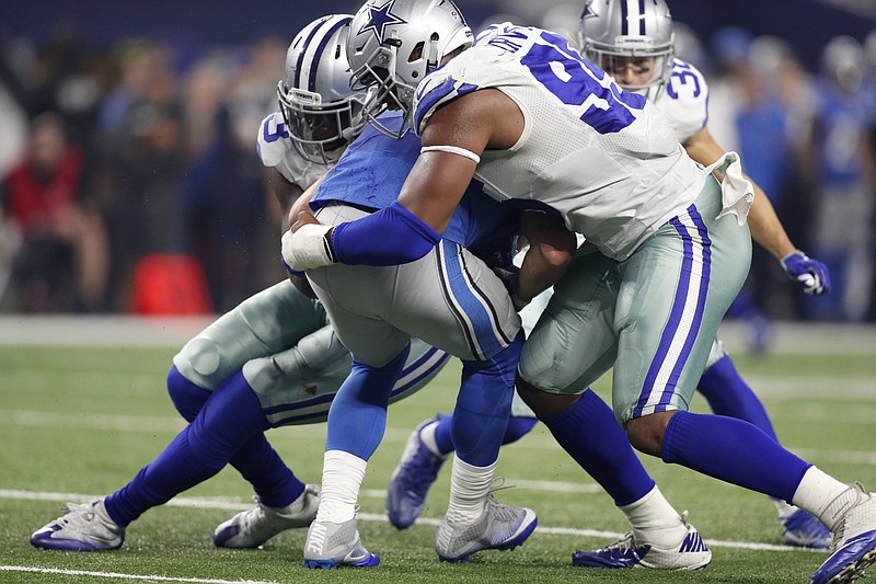 
              Dallas Cowboys' Benson Mayowa, left, and David Irving (95) combine to sack Detroit Lions' Matthew Stafford, center, in the first half of an NFL football game, Monday, Dec. 26, 2016, in Arlington, Texas. (AP Photo/Brandon Wade)
            