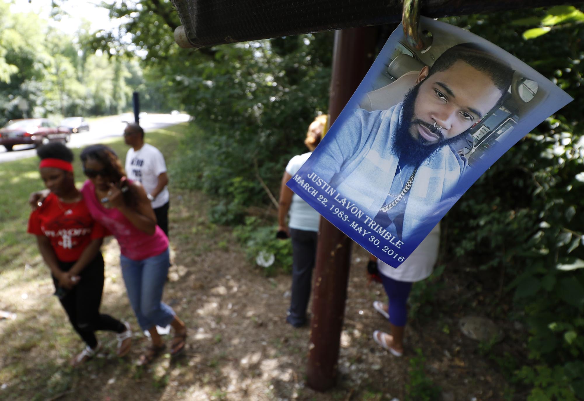 Staff Photo by Dan Henry / The Chattanooga Times Free Press- 7/7/16. Family members gather at the scene of the accident to mourn the loss of Justin LaVon Trimble who lost control of his motorcycle upon exiting the Wilcox Tunnel a month ago.
