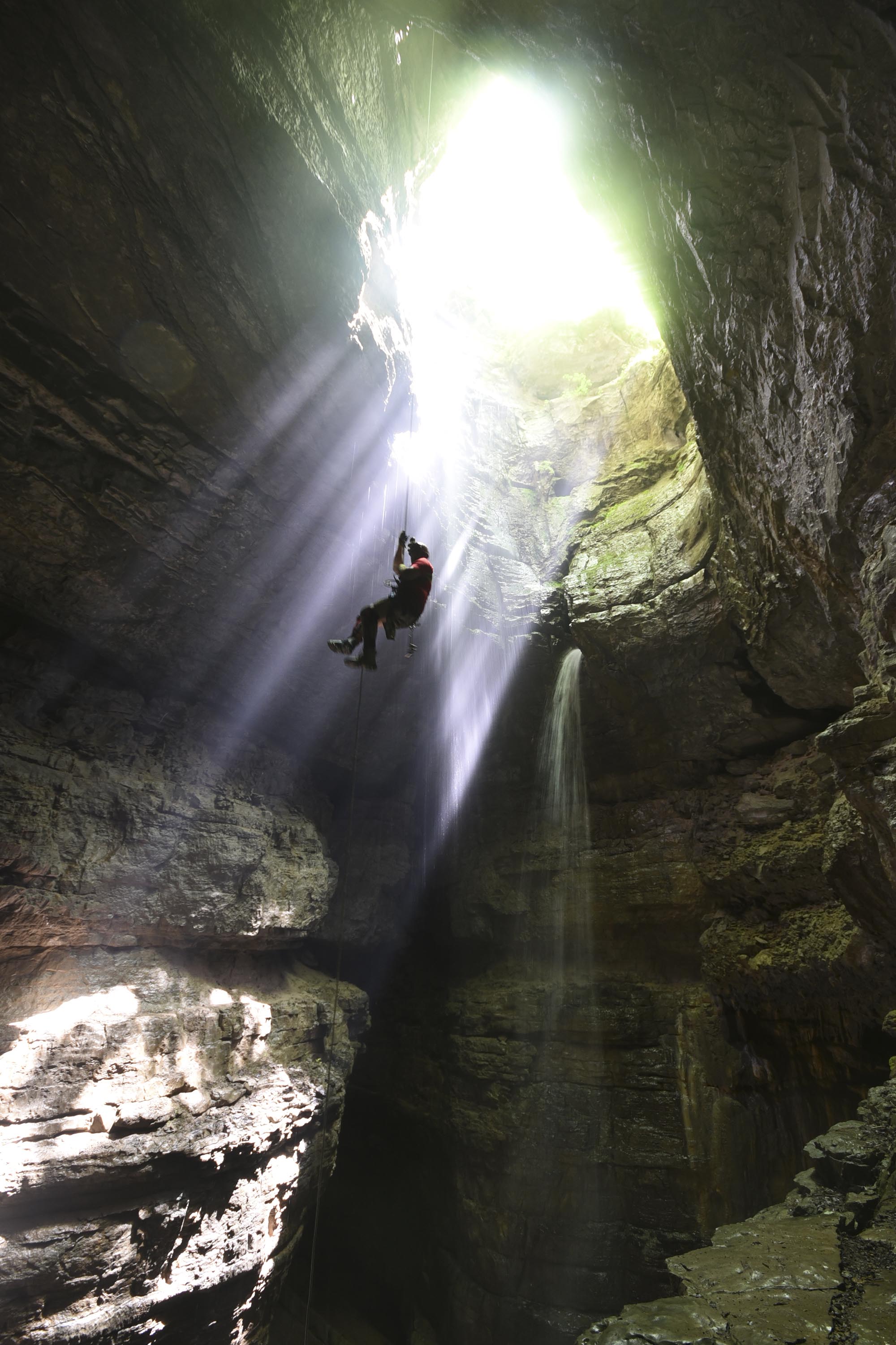 Amber Lehmann climbs out of Stephens Gap Cave, a 100-plus foot drop into the SCCi property in Jackson County, Ala.