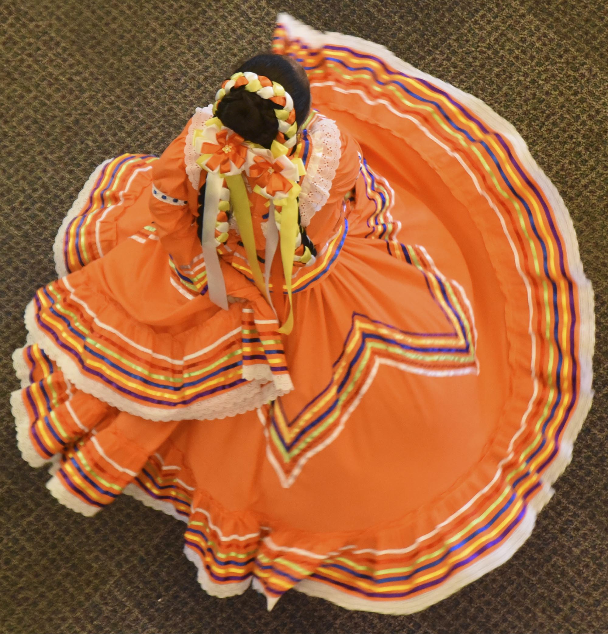 Keily Camarillo dances with CLILA's Danza Folclorica during the Folk and Traditional Arts Festival Sunday, June 26, 2016 at the Creative Discovery Museum.