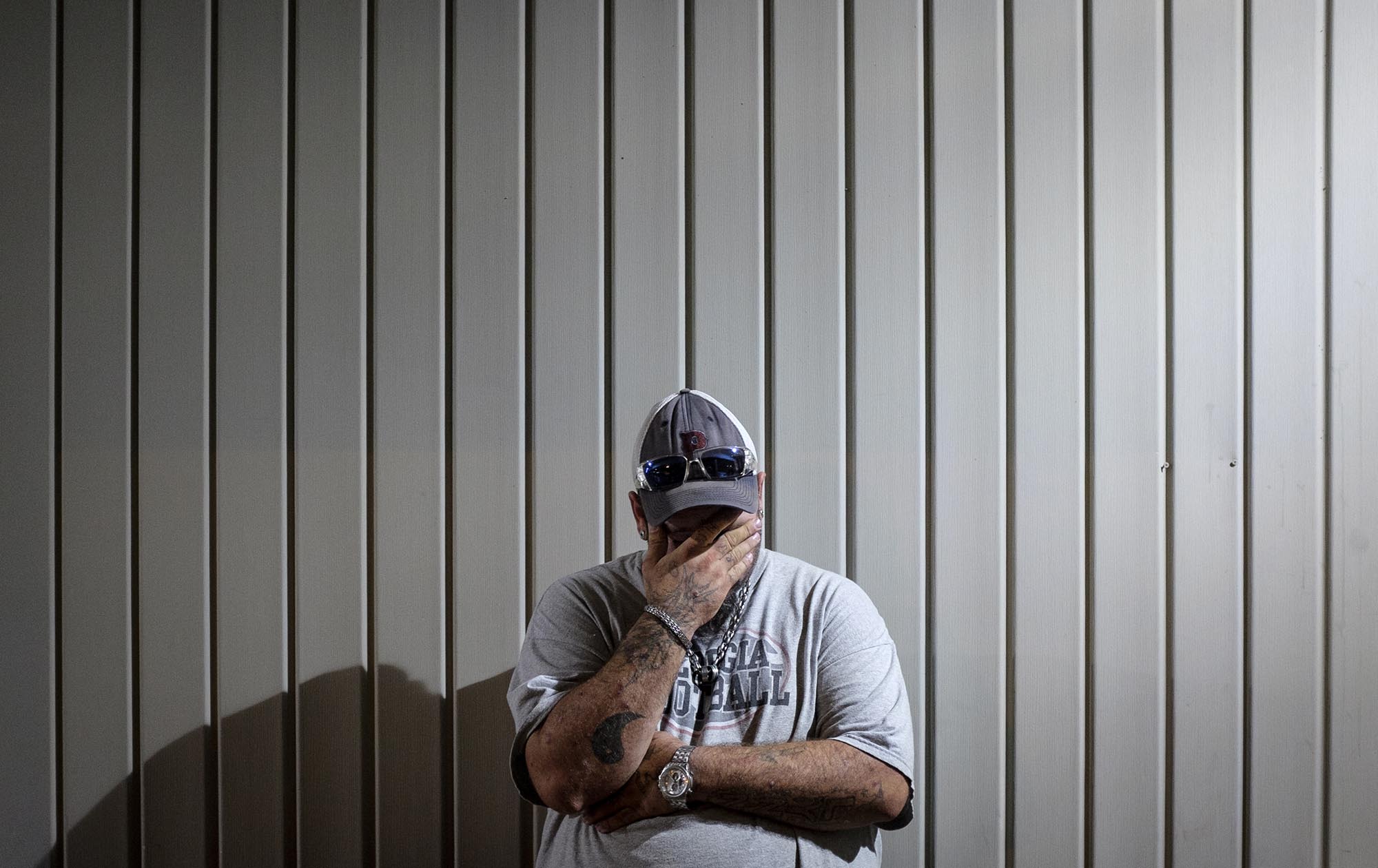 Ricky Varnell waits for a work assignment outside of the day-labor staffing company Command Center on Brainerd Road at 6 a.m. in September of 2015. Once he and others have been given their day's job assignments, they travel to their work sites and often carpool.
