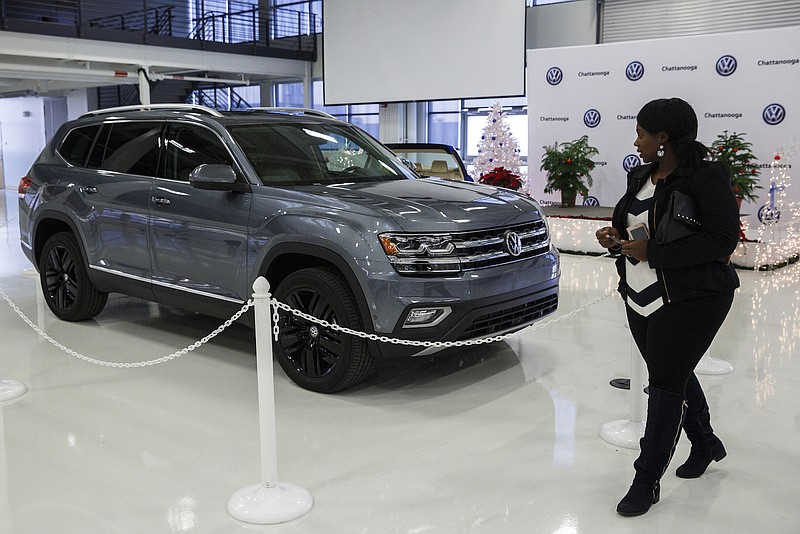 Staff photo by Doug Strickland / Antoinette Dupree looks at the new Volkswagen Atlas SUV during a December job fair with staffing contractor Aerotek held at the VW plant. The factory is slated to be up to 3,400 employees by next spring.