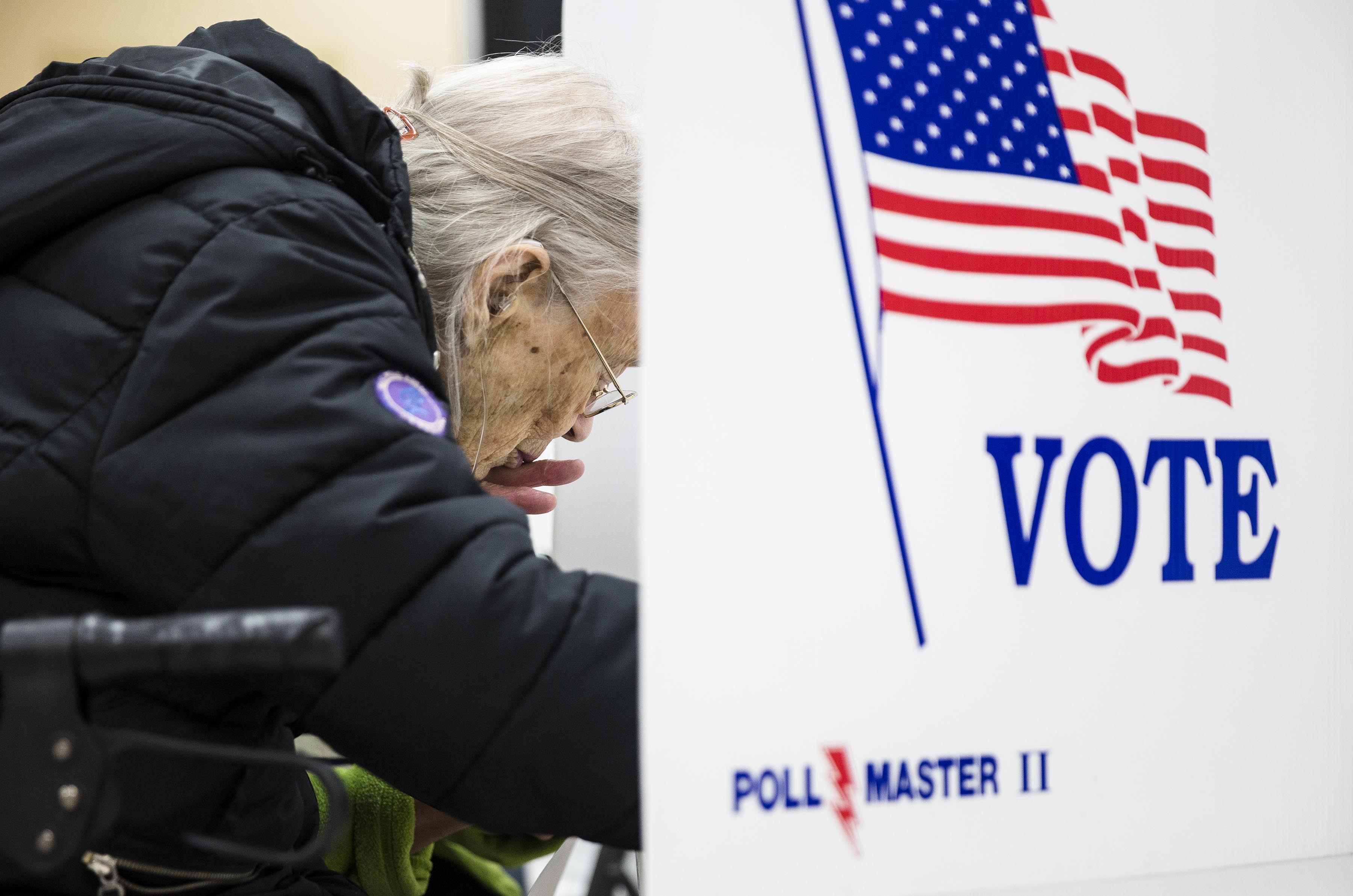 Garvin Colburn casts her ballot during early voting at the Hamilton County Election Commission on Amnicola Highway on Saturday, Oct. 22, 2016, in Chattanooga, Tenn.