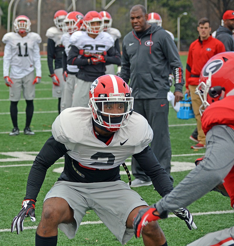 Georgia defensive back Maurice Smith works out Tuesday in Memphis as first-year Bulldogs defensive coordinator Mel Tucker looks on.