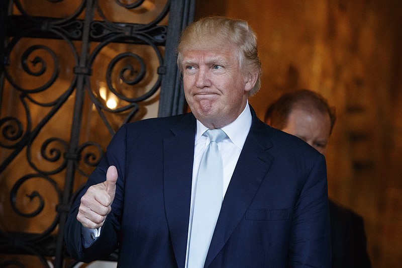 
              President-elect Donald Trump gives a thumbs up to reporters at Mar-a-Lago, Wednesday, Dec. 28, 2016, in Palm Beach, Fla. (AP Photo/Evan Vucci)
            