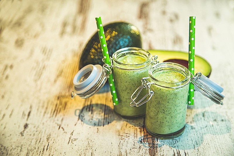 Healthy green Smoothie on wooden table