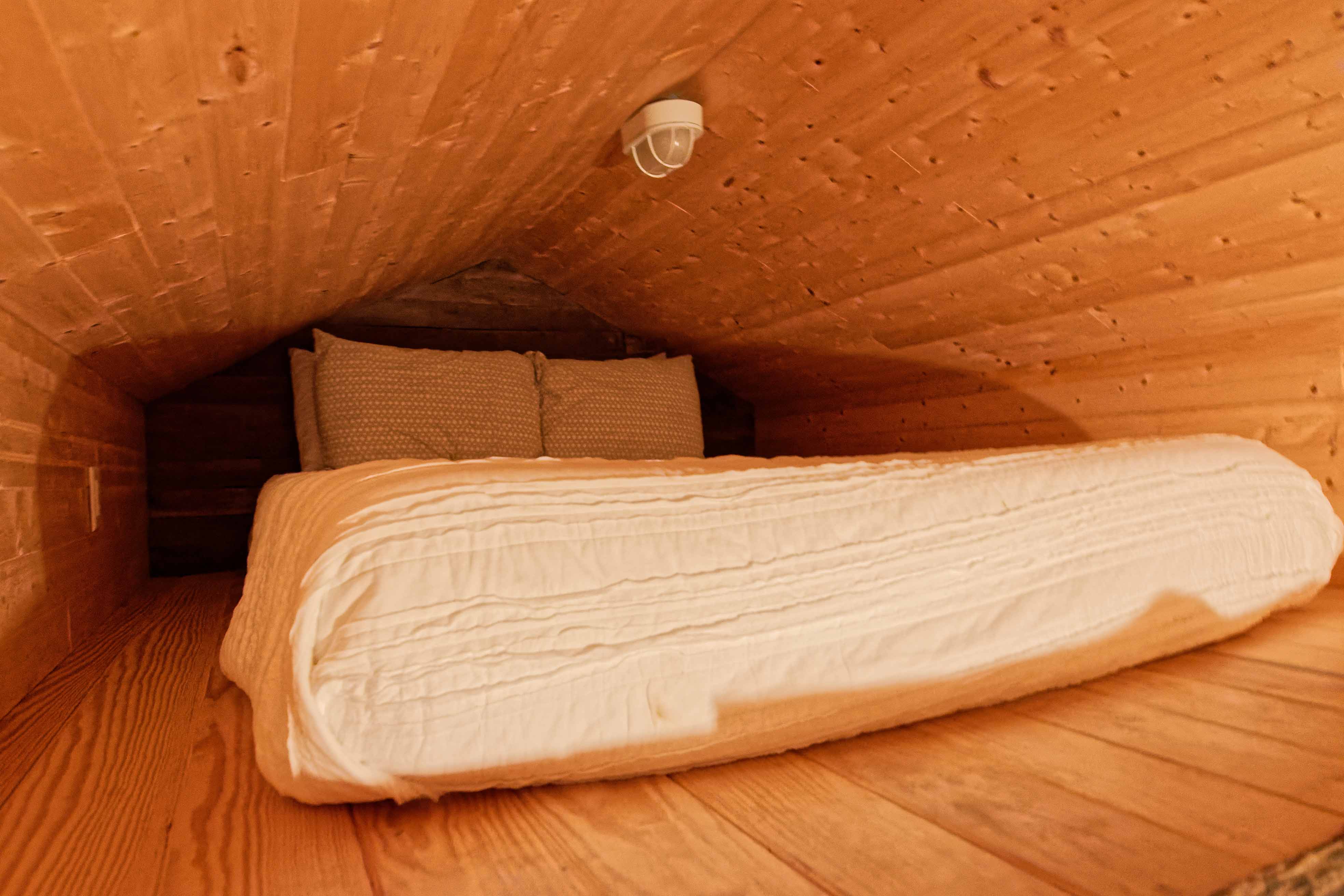 As cozy as it is compact, this bed loft is ideal for the vertically challenged. Writer Sunny Montgomery, who stands 5-foot-2, fit perfectly. (Photo by Jennifer Woods)