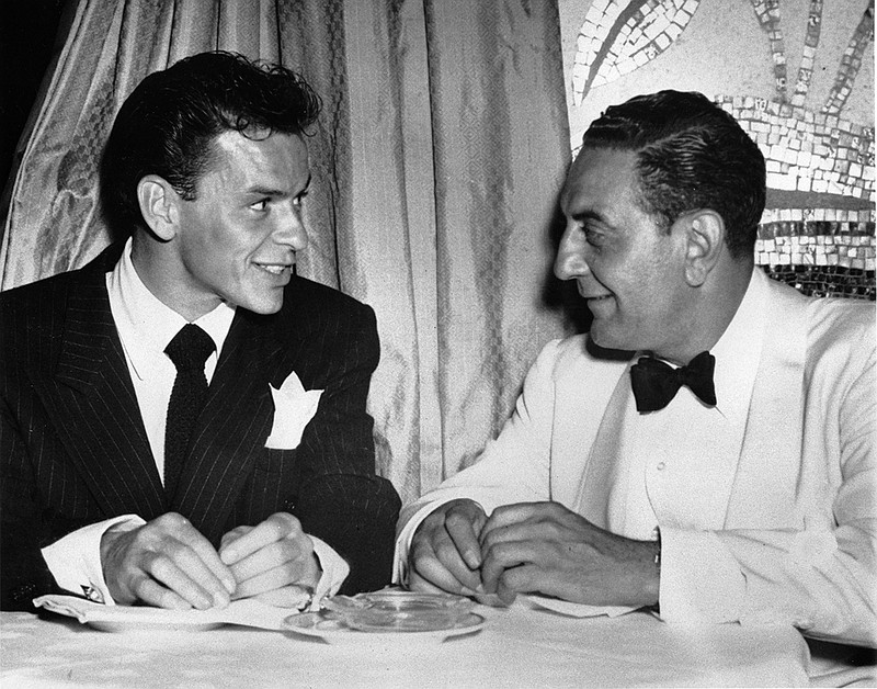 Frank Sinatra, left, chats with orchestra leader Guy Lombardo at New York's Waldorf-Astoria July 18, 1946. (AP Photo)