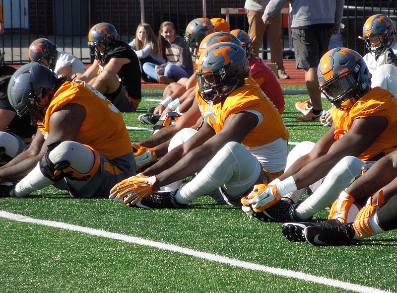 Tennessee defensive linemen Jonathan Kongbo (center) and LaTroy Lewis (right) stretch before the team's practice at Montgomery Bell Academy on Dec. 27. The Vols are in Nashville for the Music City Bowl, where they'll face Nebraska.