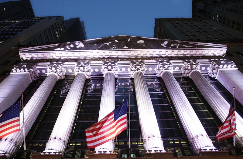 
              FILE - In this Wednesday, Oct. 8, 2014, file photo, American flags fly in front of the New York Stock Exchange. Global shares mostly fell in thin trading Thursday, Dec. 29, 2016, taking their cues from a slide on Wall Street. A stronger yen helped send Japanese stocks lower. (AP Photo/Mark Lennihan, File)
            