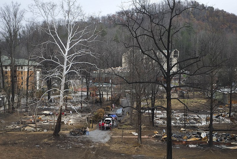 Destroyed structures are pictured along Cherokee Orchard Road on Tuesday, Dec. 20, 2016, in Gatlinburg. The wildfires killed 12 people. One more died of a heart attack and another in a vehicle accident fleeing the blaze. A total of 191 were treated for injuries suffered. More than 2,460 structures were damaged or destroyed. (Paul Efird/Knoxville News Sentinel)