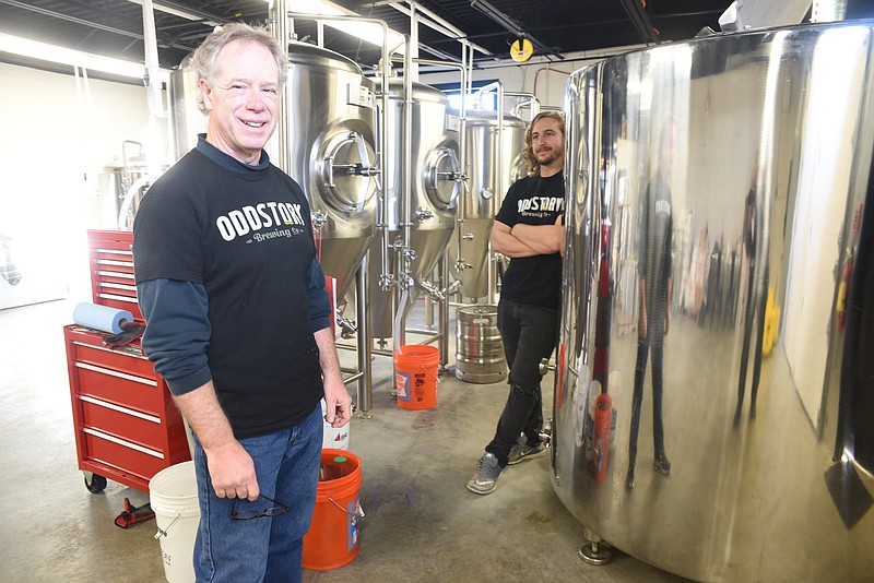 Owner's Bryan Boyd, left, and Jay Boyd stand amidst all new stainless steel beer equipment in the brewing room at OddStory Brewing Co. on M.L. King Blvd.