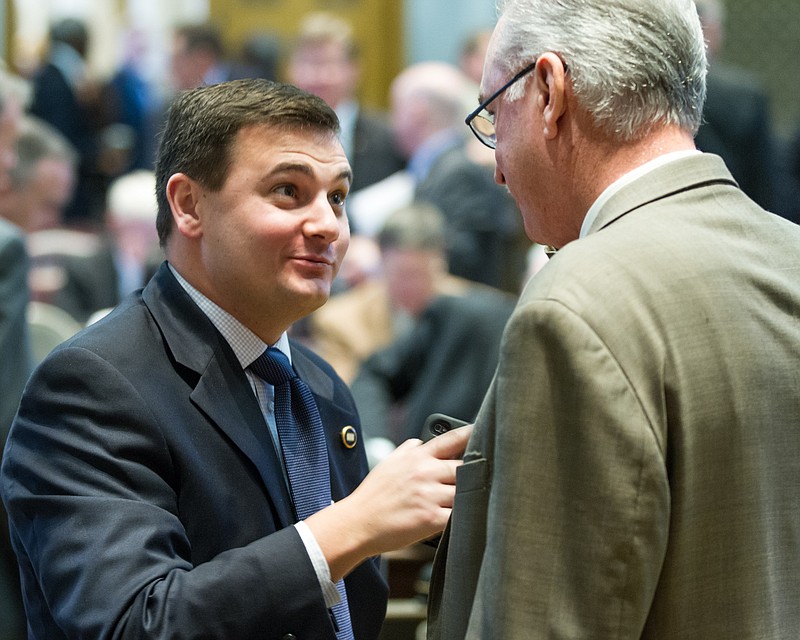 Newly appointed House State Government Chairman Ryan Haynes, R-Knoxville, speaks with Rep. Kent Williams, I-Elizabethton, after a floor session in Nashville, Tenn. on Thursday, Jan. 10, 2013. Haynes has expressed reservations about a proposal to allow wine sales in supermarkets, while Williams, who was also appointed to Haynes' committee, opposes the move. (AP Photo/Erik Schelzig)