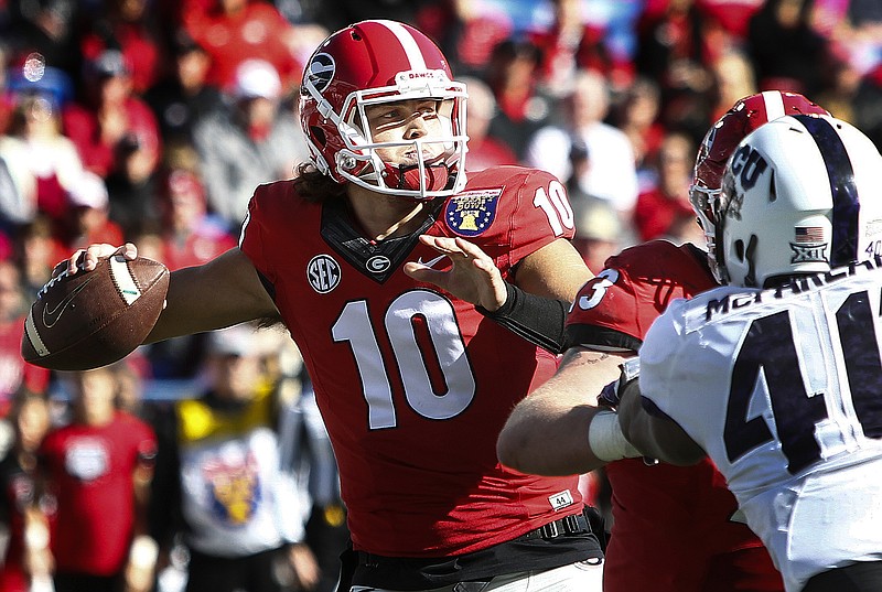 Georgia quarterback Jacob Eason makes a throw against TCU  during the first quarter of the Liberty Bowl NCAA college football game, Friday, Dec. 30, 2016, in Memphis, Tenn. (Mark Weber/The Commercial Appeal via AP)