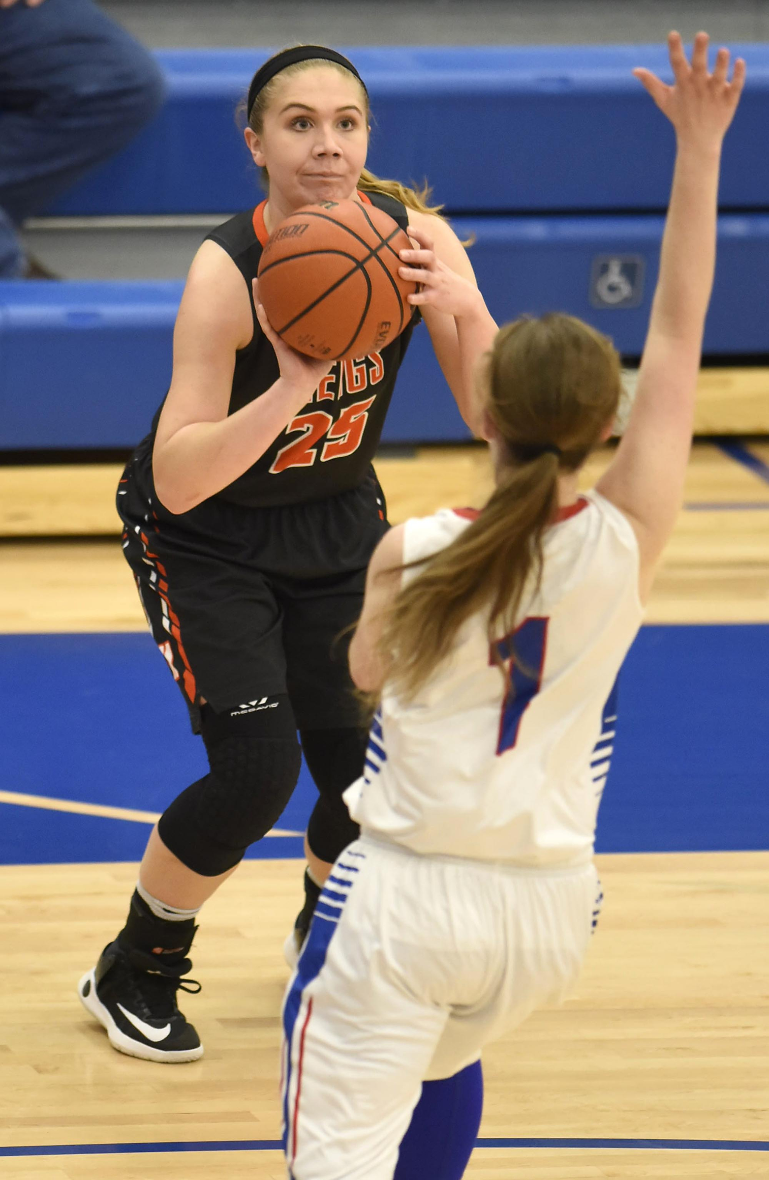 Meigs County's Alyson Crowder (25) takes aim as she shoots a three-point shot. The Meigs County Lady Tigers visited the Cleveland Lady Raiders in TSSAA girls basketball action during the Cleveland Holiday Tournament held on Friday December 30, 2016.