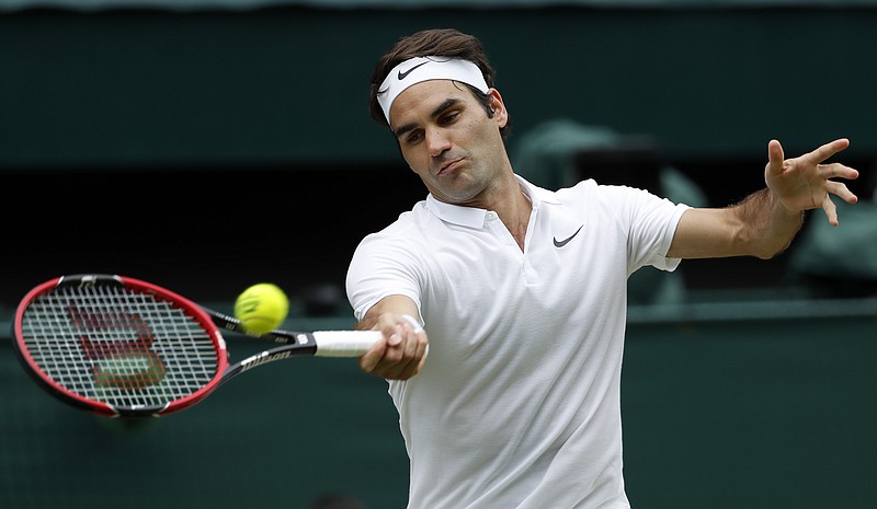 
              FILE - In this July 8, 2016, file photo, Roger Federer of Switzerland returns to Milos Raonic of Canada during their men's semifinal singles match at the Wimbledon Tennis Championships in London. Federer will return to competitive tennis at the Hopman Cup tournament in Perth, Australia, starting on Jan. 1, 2017.  (AP Photo/Ben Curtis, File)
            