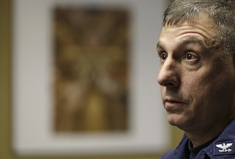 
              Capt. Michael Mullen of the U.S. Coast Guard answers questions during a news conference at Burke Lakefront Airport, Friday, Dec. 30, 2016, in Cleveland. The U.S. Coast Guard said there's been no sign of debris or those aboard a plane that took off from the airport on the shores of Lake Erie and went missing overnight. (AP Photo/Tony Dejak)
            