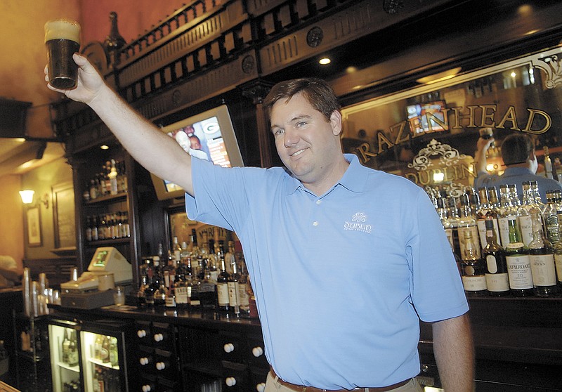 In this Aug. 1, 2008 photo, Dublin Irish Festival honorary chairman John T. Fleming proposes at toast following the tapping of the first Dublin Stout Keg at Brazenhead in Dublin, Ohio. A flight-tracking service shows that a plane piloted by the Ohio executive with five other people onboard quickly lost altitude after taking off from Cleveland's lakeshore airport. The parents of Superior Beverage Company executive John T. Fleming confirmed he was piloting the Columbus-bound plane when it vanished late Thursday, Dec. 29, 2016, over Lake Erie. (ThisWeek Newspapers/The Columbus Dispatch via AP)