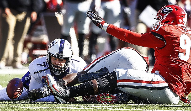 TCU quarterback Kenny Hill (7) watches a fumbled ball bounce away against the Georgia defense during the second quarter of the Liberty Bowl NCAA college football game, Friday, Dec. 30, 2016, in Memphis, Tenn. (Mark Weber/The Commercial Appeal via AP)