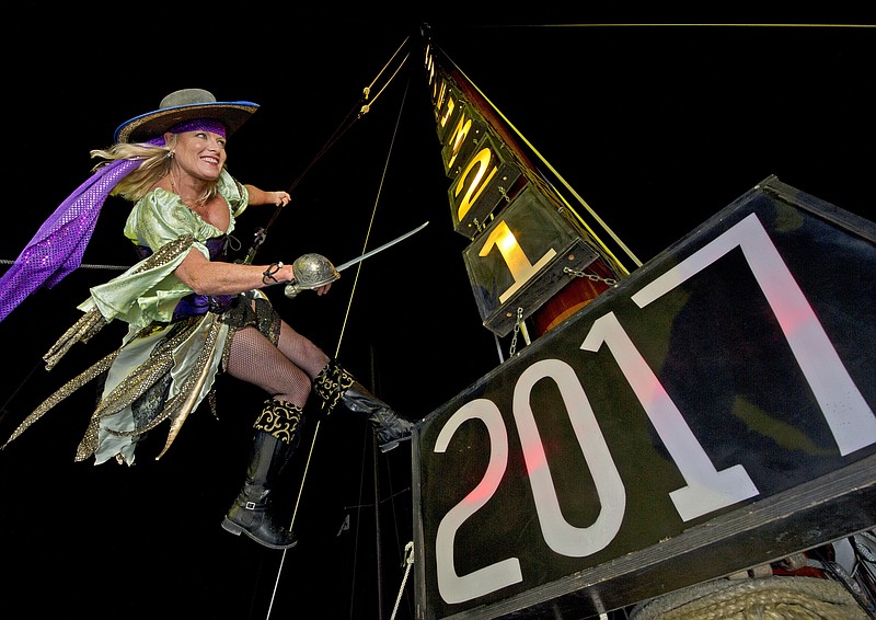
              In this Friday, Dec. 30, 2016, photo provided by the Florida Keys News Bureau, Evalena Worthington, costumed as a pirate wench, practices being lowered from the mast of the sailing vessel America 2.0 outside the Schooner Wharf Bar in Key West, Fla. Emotionally wrenching politics, foreign conflicts and shootings at home took a toll on Americans in 2016, but they are entering 2017 on an optimistic note, according to a new poll that found that a majority believes things are going to get better for the country next year.  (Rob O'Neal/Florida Keys News Bureau via AP)
            