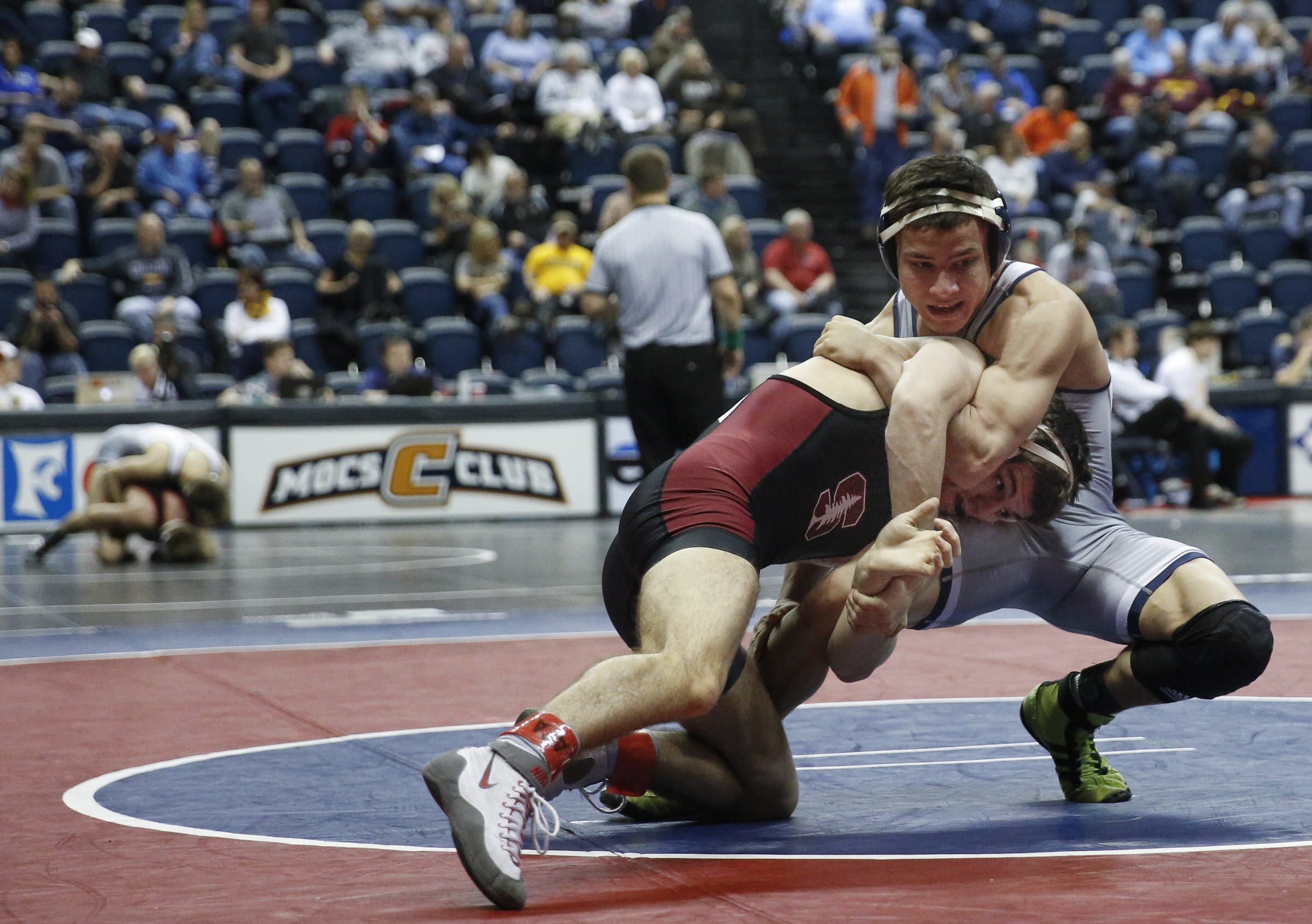 Chattanooga wrestler Chris Debien, right, wrestles Stanford's Peter Russo in their losers-bracket round of 16 bout of the Southern Scuffle wrestling tournament at McKenzie Arena on Sunday, Jan. 1, 2016, in Chattanooga, Tenn.