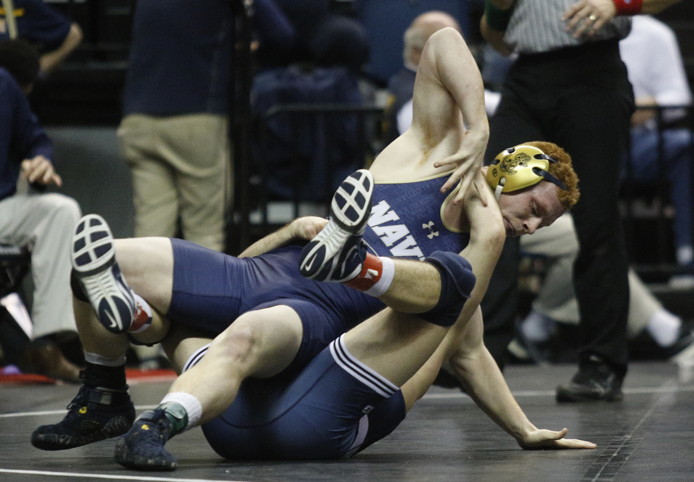 Navy wrestler Jared Prince, top, wrestles Penn. State wrestler Kade Moss in their round of 16 bout of the Southern Scuffle wrestling tournament at McKenzie Arena on Sunday, Jan. 1, 2016, in Chattanooga, Tenn.