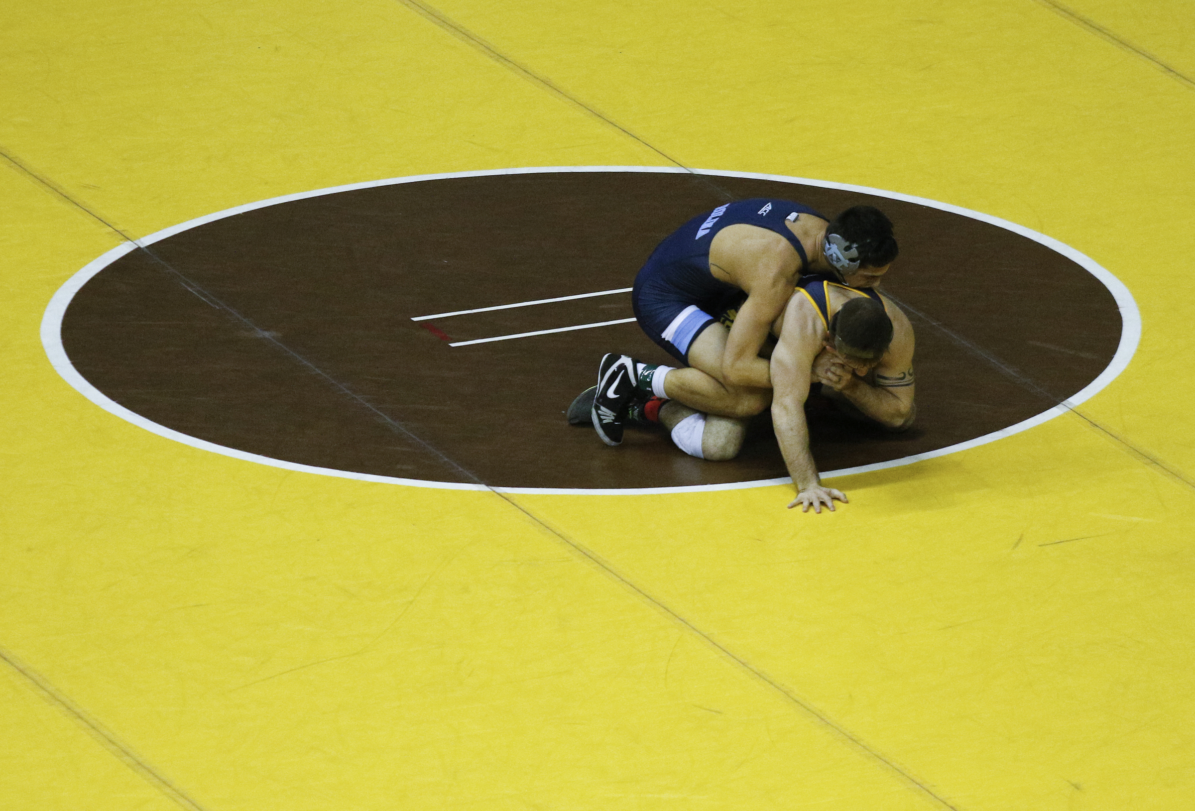 North Carolina wrestler Joey Ward, top, wrestles Northern Colorado wrestler Timmy Box in their round of 16 bout of the Southern Scuffle wrestling tournament at McKenzie Arena on Sunday, Jan. 1, 2016, in Chattanooga, Tenn.