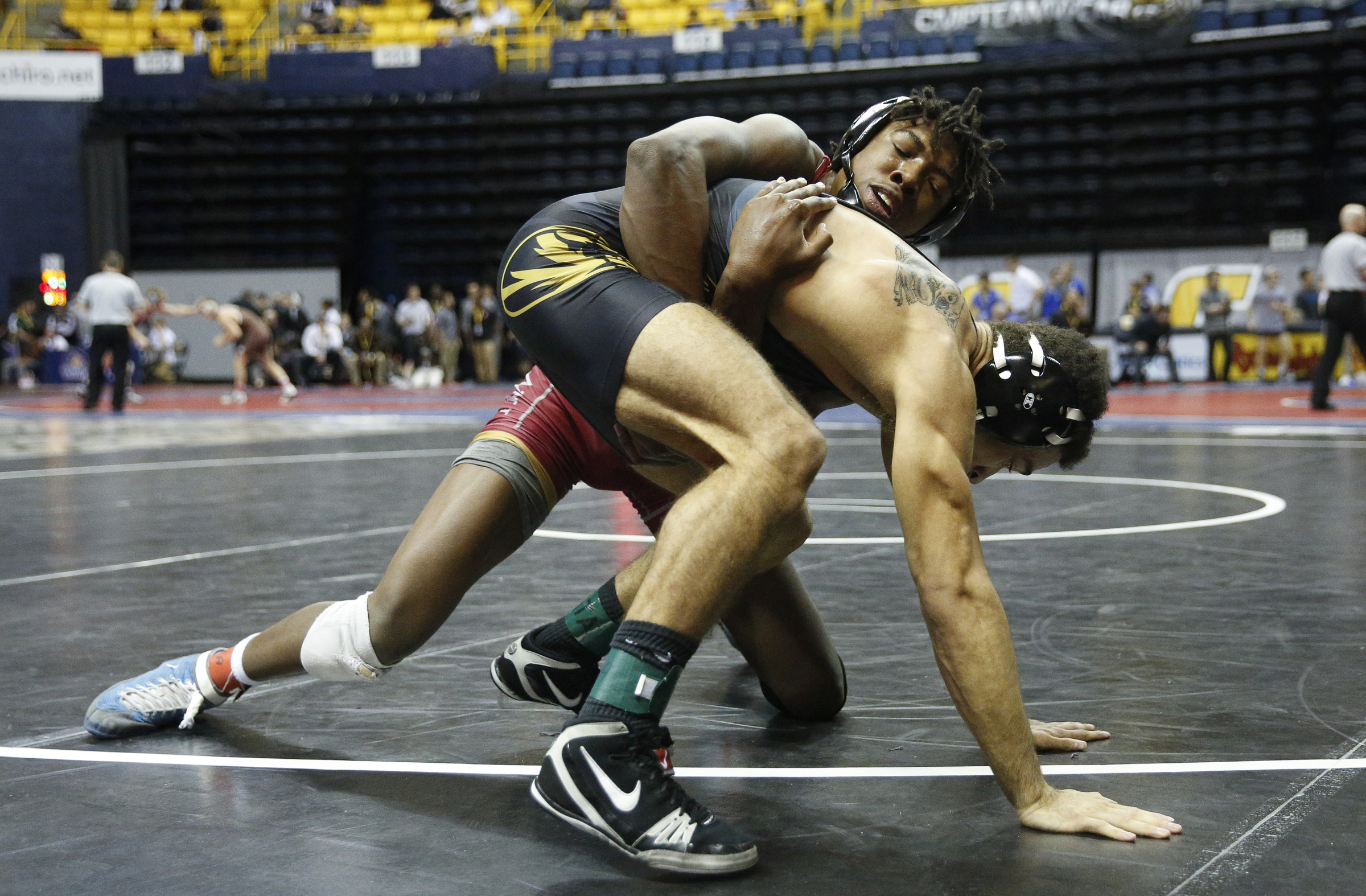 Missouri wrestler Lavion Mayes, right, wrestles North Carolina wrestler Kennedy Monday in their round of 16 bout of the Southern Scuffle wrestling tournament at McKenzie Arena on Sunday, Jan. 1, 2016, in Chattanooga, Tenn.