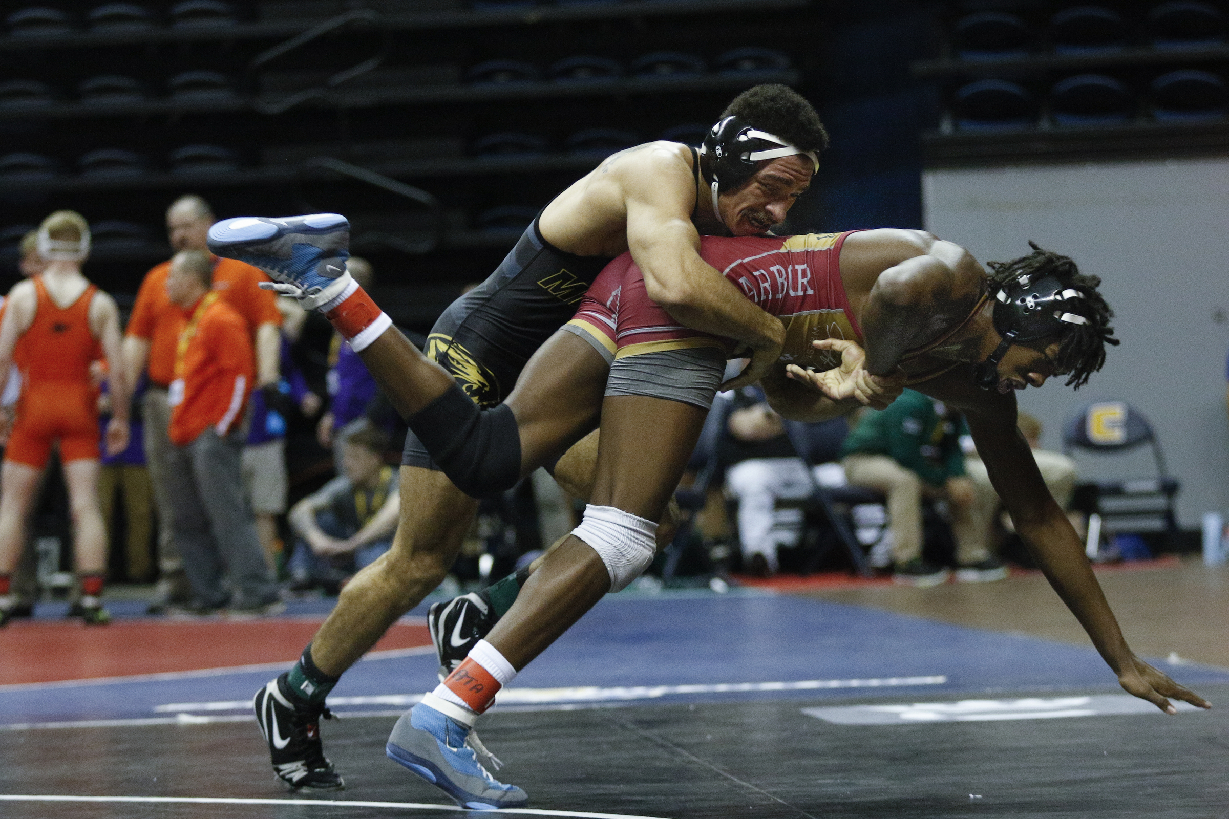 Missouri wrestler Lavion Mayes, left, takes down North Carolina wrestler Kennedy Monday in their round of 16 bout of the Southern Scuffle wrestling tournament at McKenzie Arena on Sunday, Jan. 1, 2016, in Chattanooga, Tenn.