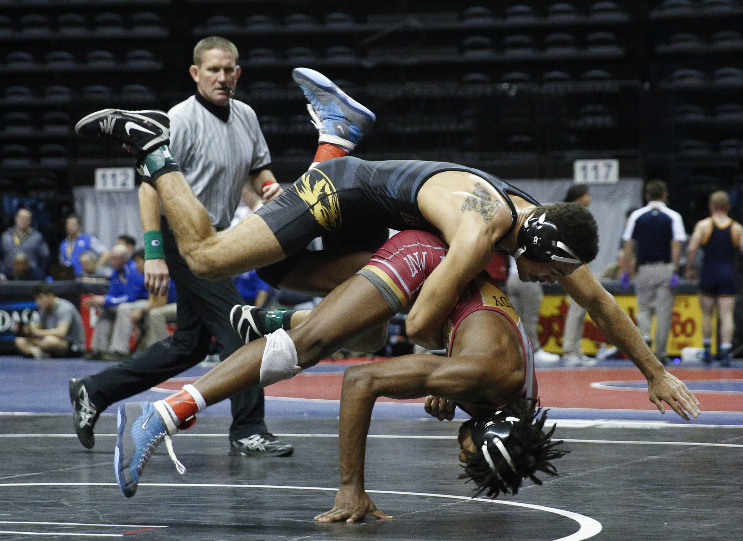 Missouri wrestler Lavion Mayes, top, takes down North Carolina wrestler Kennedy Monday in their round of 16 bout of the Southern Scuffle wrestling tournament at McKenzie Arena on Sunday, Jan. 1, 2016, in Chattanooga, Tenn.