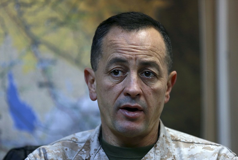 
              Brig. Gen. Rick Uribe listens during an interview with The Associated Press in Irbil, 217 miles (350 kilometers) north of Baghdad, Iraq, Sunday, Jan. 1, 2017. In the interview Uribe, a senior U.S. military commander in Iraq, expressed confidence in Iraqi forces fighting to recapture the northern city of Mosul from Islamic State militants. Uribe said he agrees with the forecast given by Iraqi Prime Minister Haider al-Abadi that it would take another three months to liberate Mosul, the last Iraqi urban center still in the hands of the extremist group. (AP Photo/Khalid Mohammed)
            