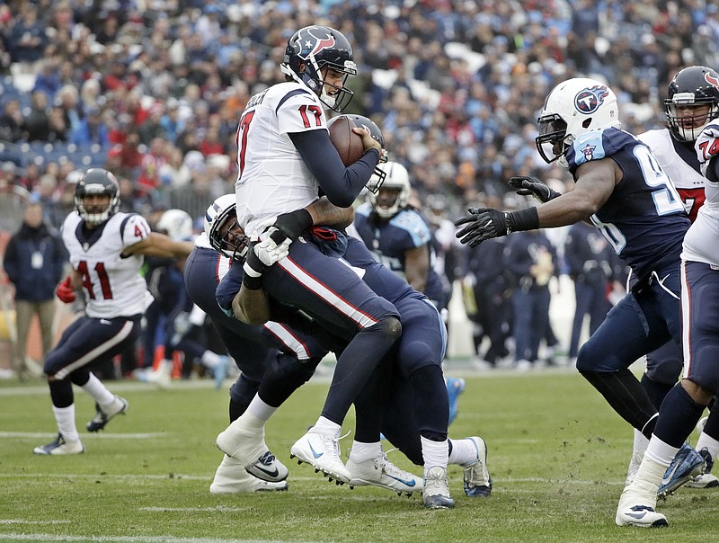 Houston Texans quarterback Brock Osweiler (17) is sacked by Tennessee Titans defensive tackle Jurrell Casey for an 8-yard loss in the first half of an NFL football game Sunday, Jan. 1, 2017, in Nashville, Tenn. (AP Photo/James Kenney)

